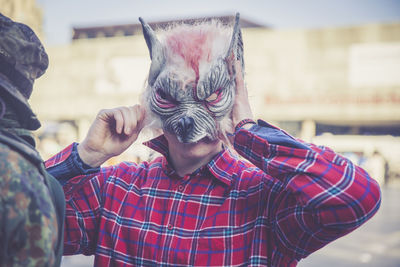 Close-up of man standing against blurred background