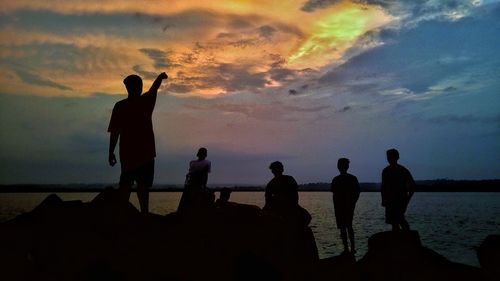 Silhouette of people on beach