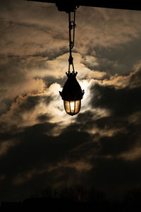 Low angle view of illuminated lamp against sky