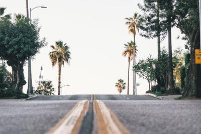 Surface level of road against clear sky