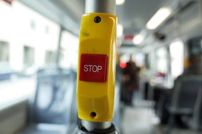 Close-up of stop button in bus