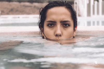 Portrait of young man in swimming pool