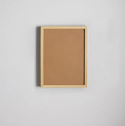 Close-up of empty chair against white background