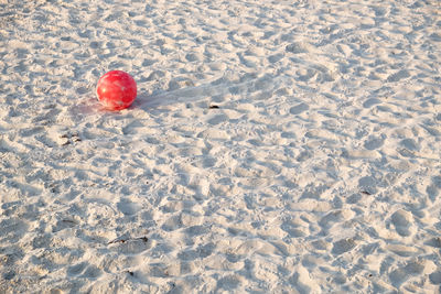 High angle view of ice cream on sand