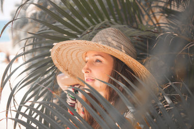 Portrait of young woman wearing hat