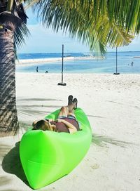 Woman lying down on beach