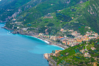 Aerial view of sea and buildings in city