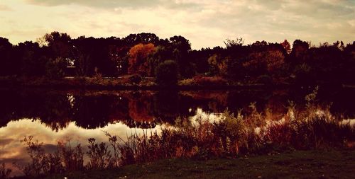 Reflection of clouds in lake at sunset