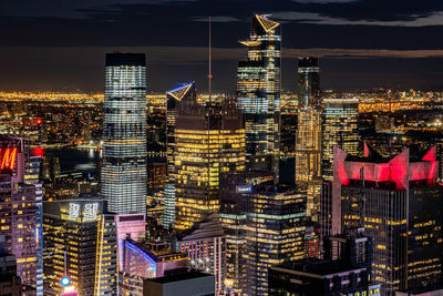 Aerial view of illuminated buildings in city at night