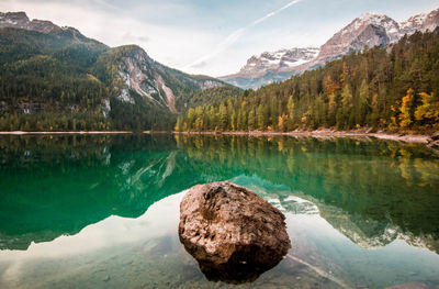 Scenic view of lake and mountains against sky