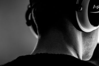 Rear view portrait of man against white background