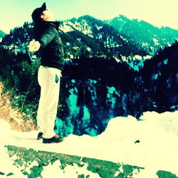 Woman standing on mountain