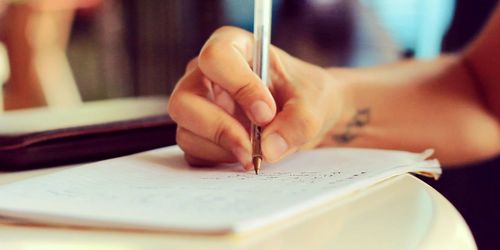 Cropped image of woman holding book