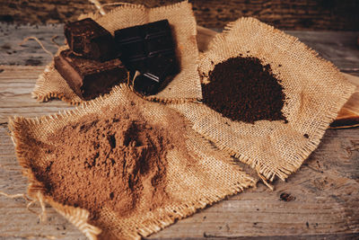 Coffee powder and chocolate bars on table