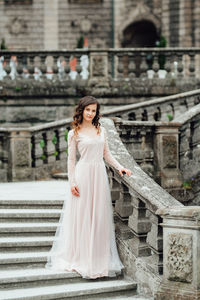 Woman standing in front of building