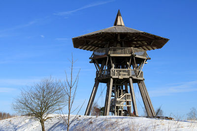 Low angle view of built structure against blue sky