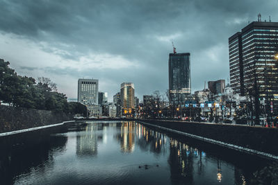 Reflection of city in water at night