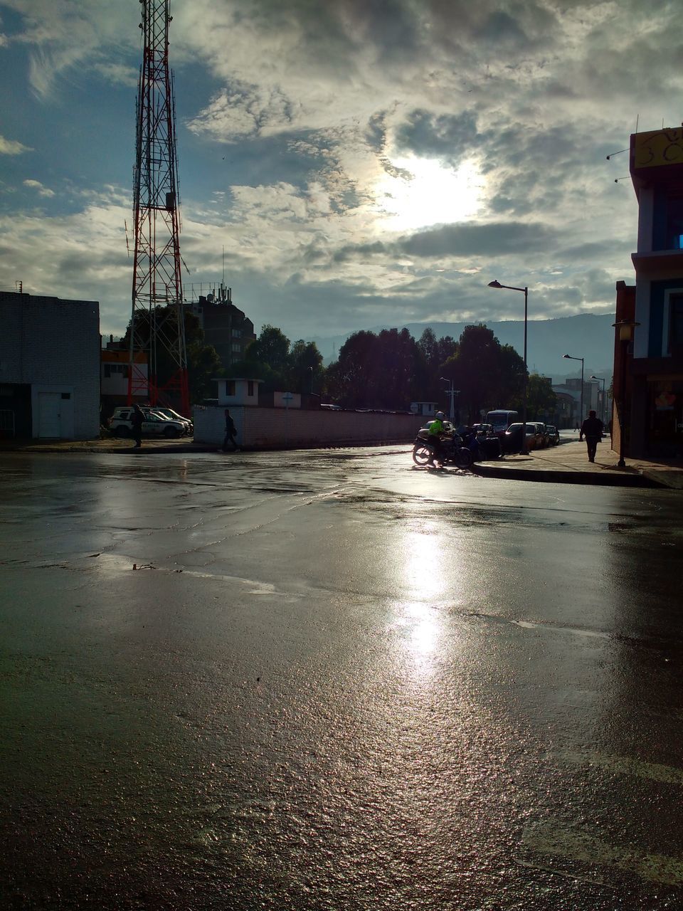 SURFACE LEVEL OF WET ROAD AGAINST SKY