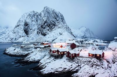 Scenic view of lofoten against snow covered mountains