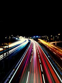 High angle view of light trails on highway at night