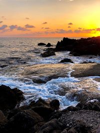 Scenic view of sea against sky during sunset