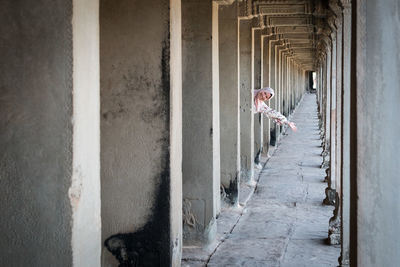 Women standing by staircase of building