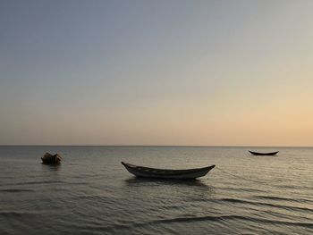 Scenic view of sea against clear sky during sunset