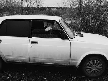 Man sitting in car