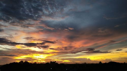 Low angle view of dramatic sky during sunset