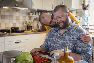 Men in kitchen preparing food