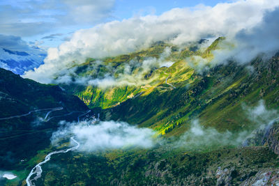 Scenic view of waterfall against sky