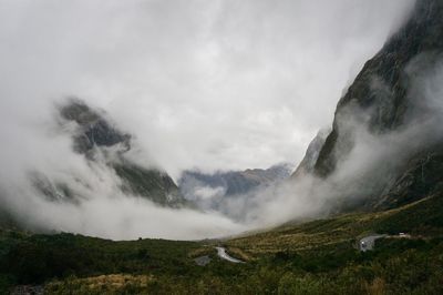 Scenic view of mountains and clouds against sky