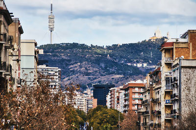 View of buildings and mountains in city, barcelona 