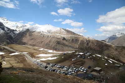 Aerial view of snowcapped mountains against sky