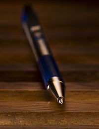 Close-up of pen on table