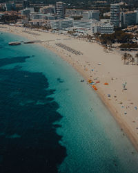 Drone footage over mallorca island beach people