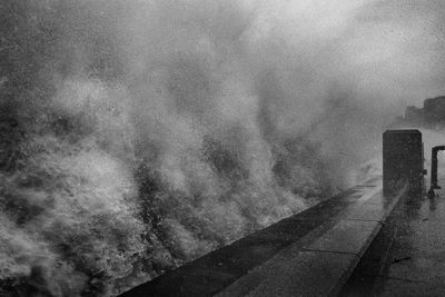 Road by building against sky