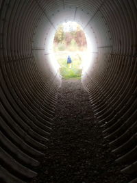 Silhouette of man in tunnel