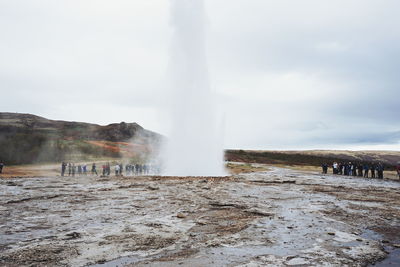 Scenic view of geyser strokkur iceland against sky