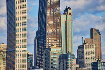 Modern buildings in city against sky