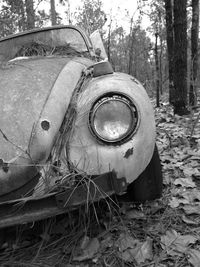 Abandoned vintage car on field