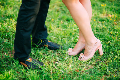 Couple standing on grass