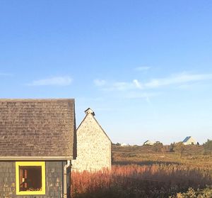 House on field against sky