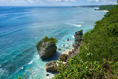 High angle view of rocks by sea