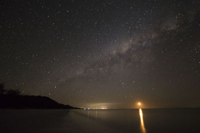 Scenic view of sea against sky at night
