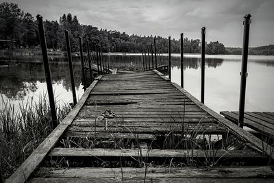 Pier over lake against sky