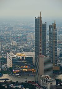 High angle view of buildings in city against sky