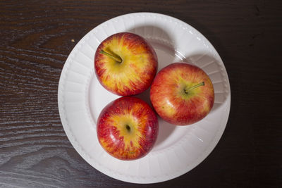 High angle view of apples in plate on table