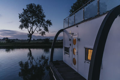 Houseboat on yser river at sunset