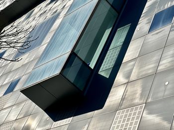 Low angle view of modern buildings against sky